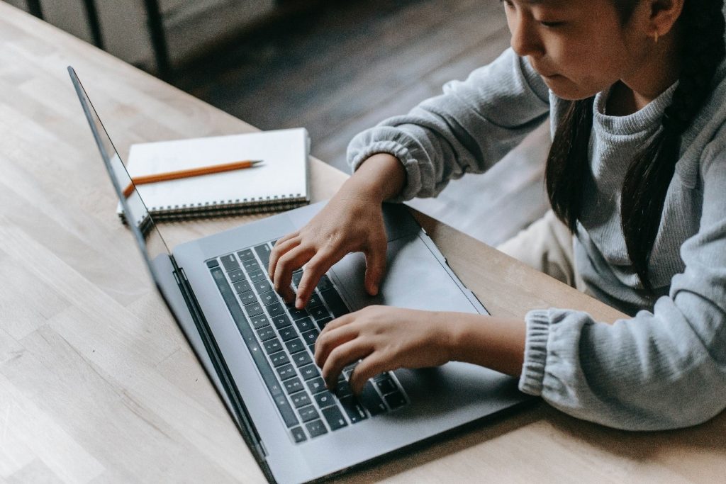 girl doing study on laptop