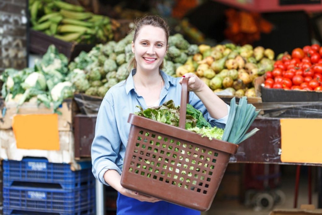 woman carrying vegetables in basket
