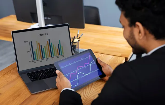 Business professional analyzing business information on a laptop